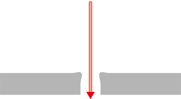 Drilling a hole in a lens